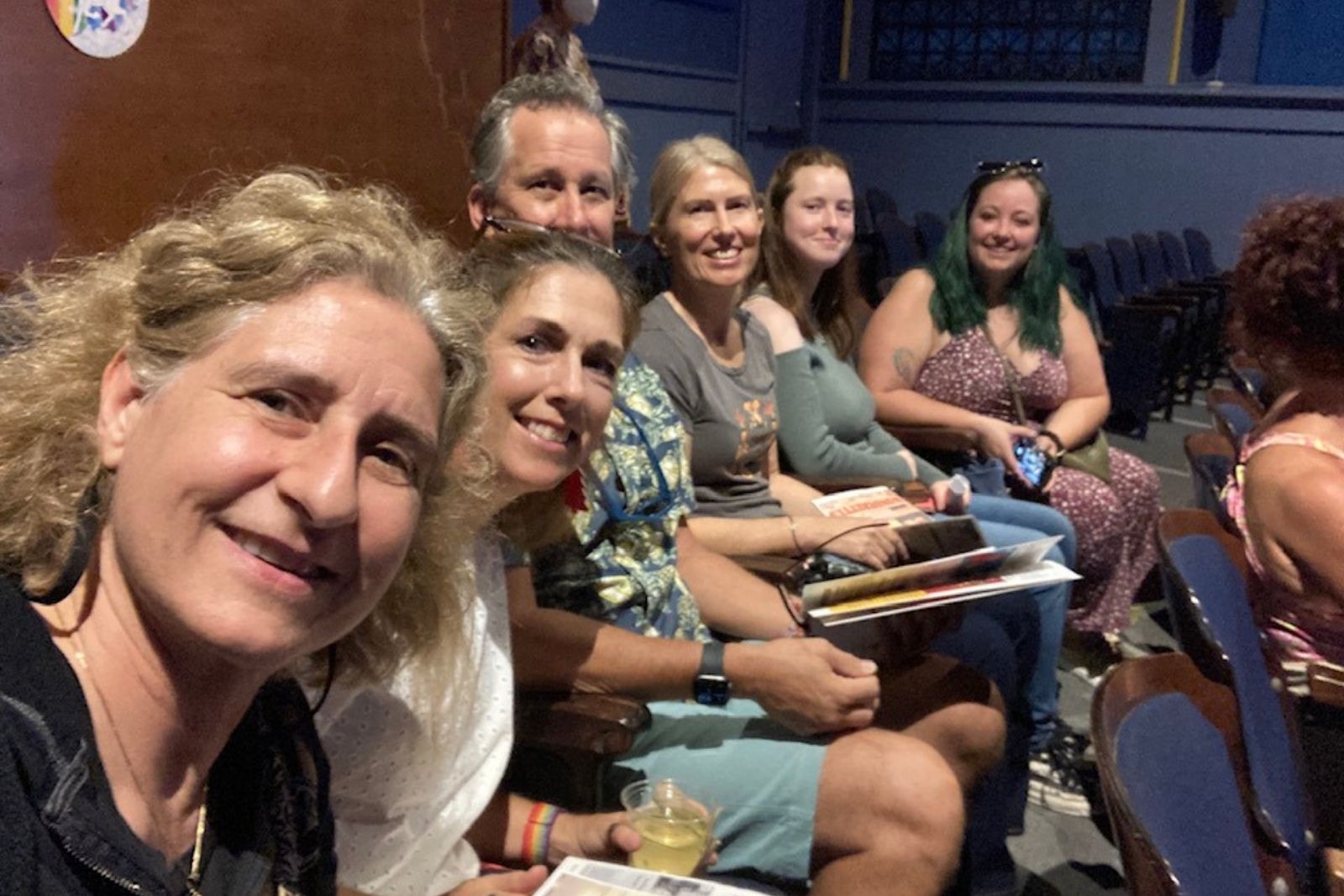 (Left to Right): Martina, Janine, Rich, Kerstin, Jessica, and Savannah sitting at the Aloha Theatre