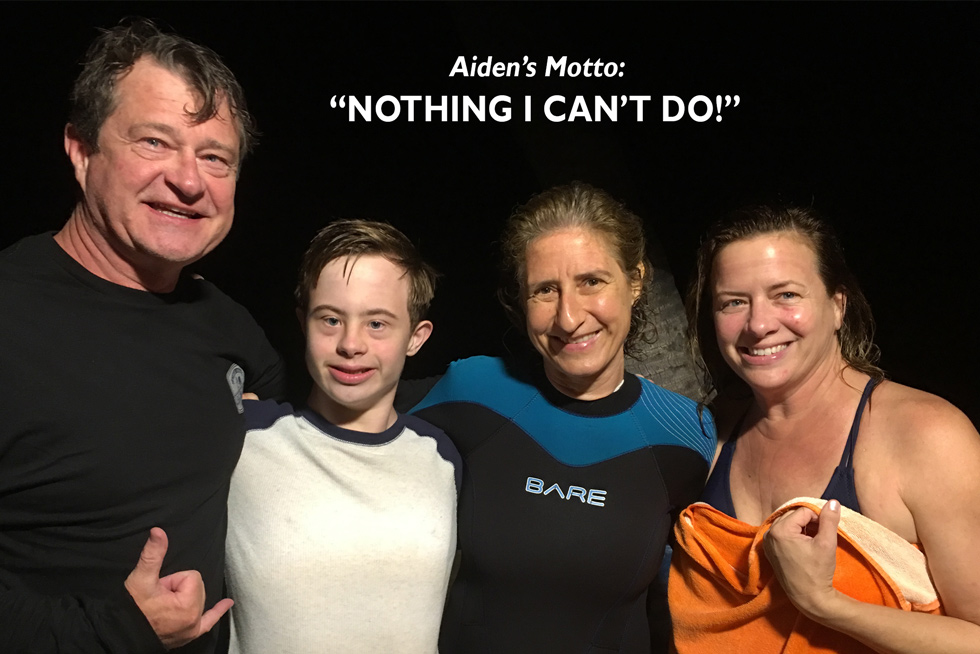 Aiden, a young man with Down Syndrome who went on the manta ray moonlight swim. Pictured with his parents - and with me, Martina Wing!