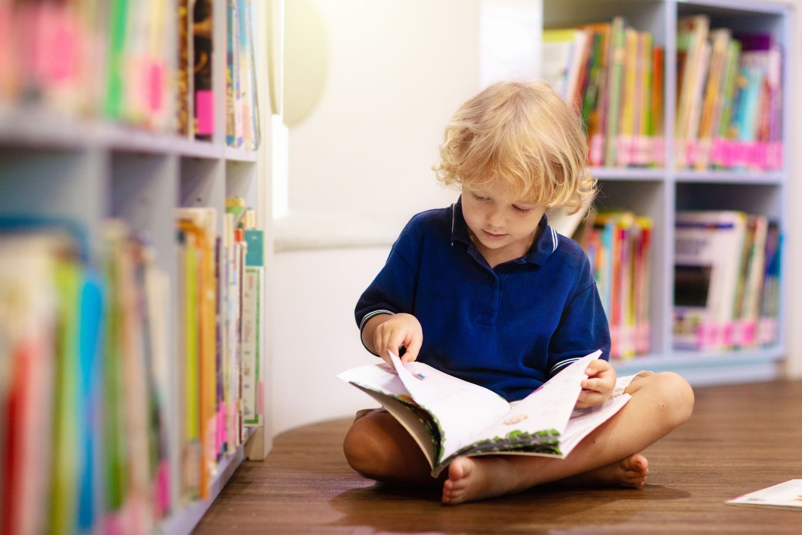 books about the ocean for kids – manta ray advocates 2 Young child reading a book - books about the ocean for kids